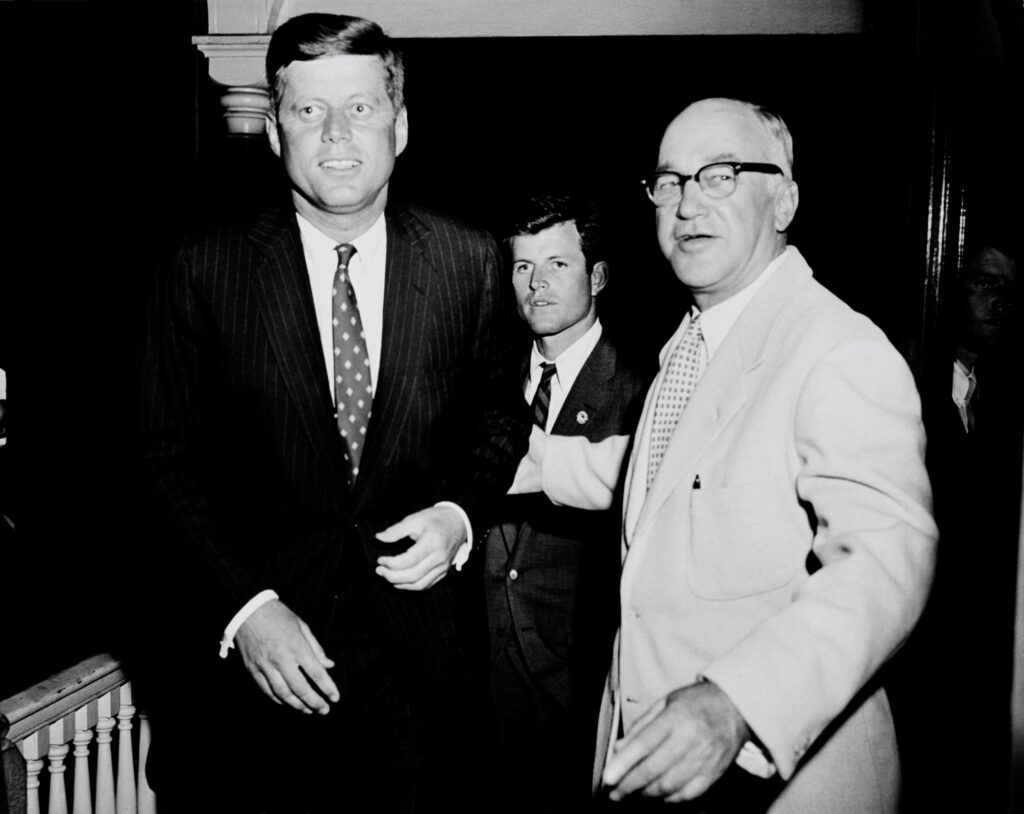 Senator Kennedy  at left with Hawthorne D. Battle, station president at right, standing outside WCHS studio, Charleston, WV 1960.